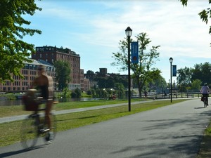 Woman riding a bike near the Lachine Canal